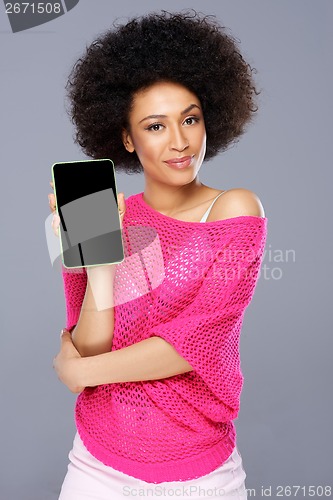 Image of Smiling African American woman with a tablet-pc