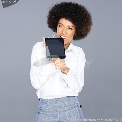 Image of Beautiful African American woman with a tablet