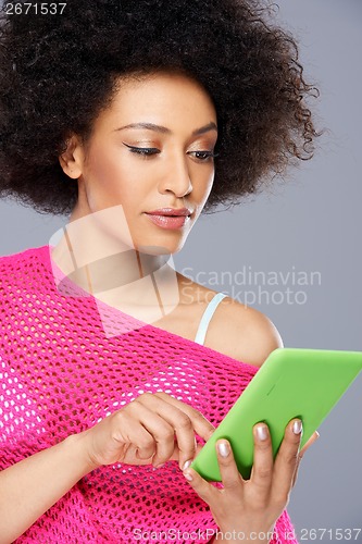 Image of Sexy African American woman with a tablet