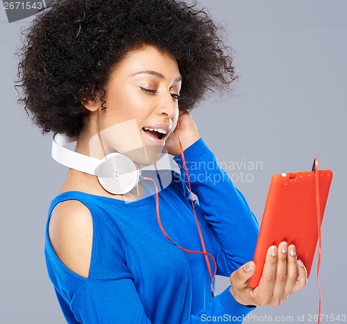 Image of Beautiful African American woman with her music