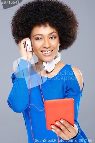 Image of Beautiful Afro-American woman listening to music