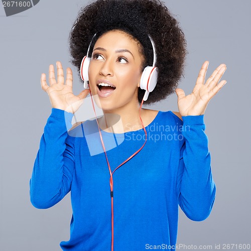 Image of Beautiful African American woman enjoying music