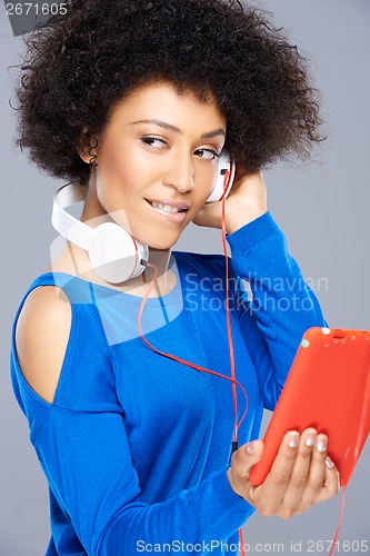 Image of Beautiful African American woman with her music