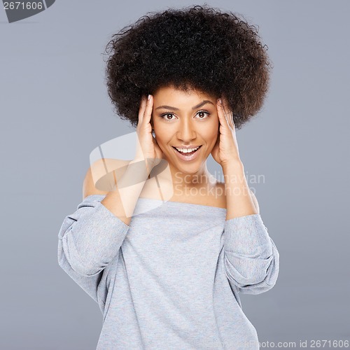 Image of Happy surprised young African American woman