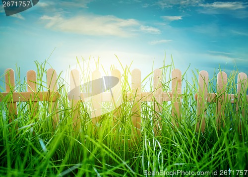 Image of Wooden fence on blue sky background