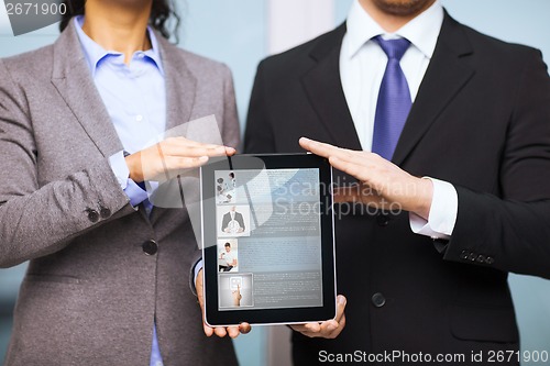 Image of businessman and businesswoman with tablet pc