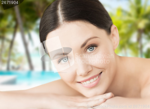 Image of smiling woman in spa salon