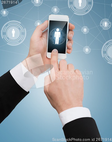 Image of businessman touching screen of smartphone