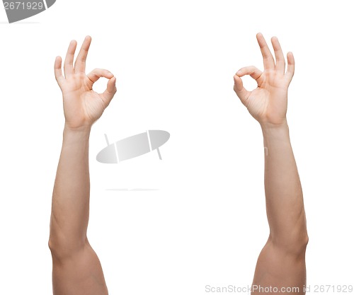 Image of man hands showing ok sign