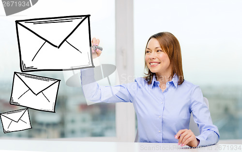 Image of businesswoman drawing envelope