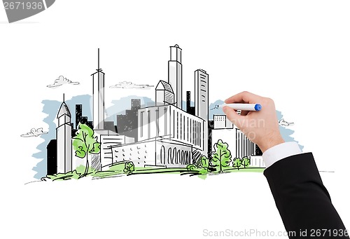 Image of close up of businessman drawing city sketch