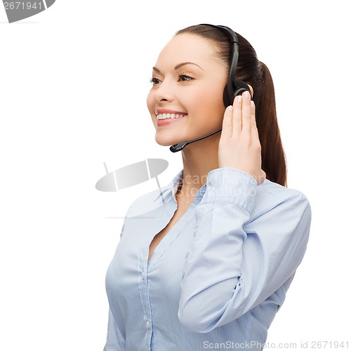 Image of friendly female helpline operator with headphones