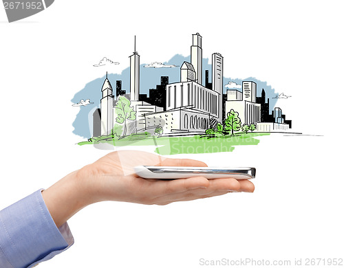 Image of woman hand with smartphone and city sketch