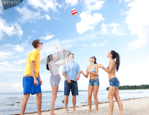 Image of group of friends having fun on the beach