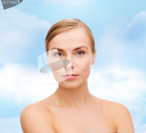 Image of face and shoulders of young woman