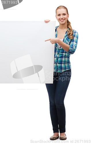 Image of smiling young woman with white blank board