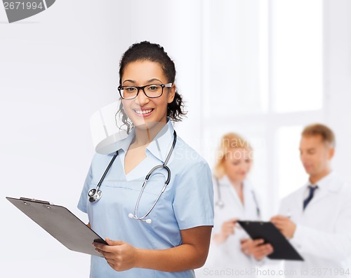 Image of smiling female african american doctor or nurse