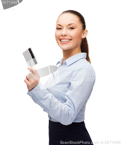 Image of smiling businesswoman showing credit card