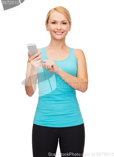 Image of sporty woman with smartphone