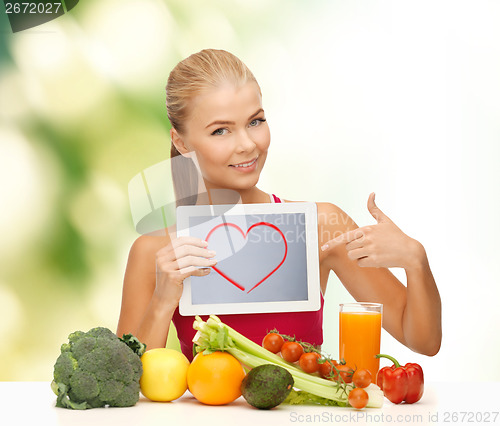 Image of woman with fruits, vegetables and tablet pc