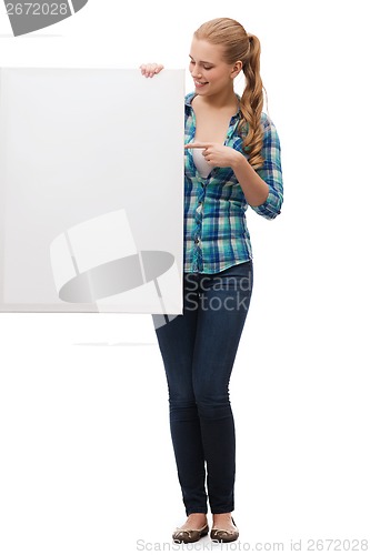 Image of smiling young woman with white blank board