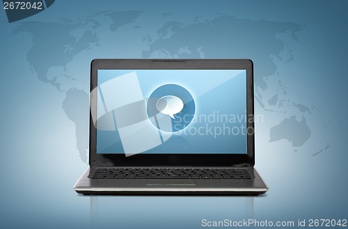 Image of laptop computer with text bubble on screen