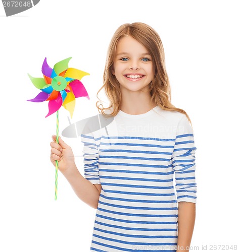 Image of smiling child with colorful windmill toy