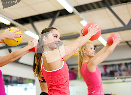 Image of group of people working out with stability balls