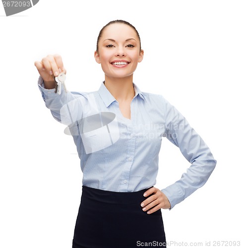 Image of smiling businesswoman with house keys