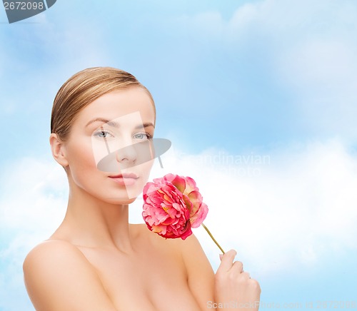 Image of lovely woman with peonie flower