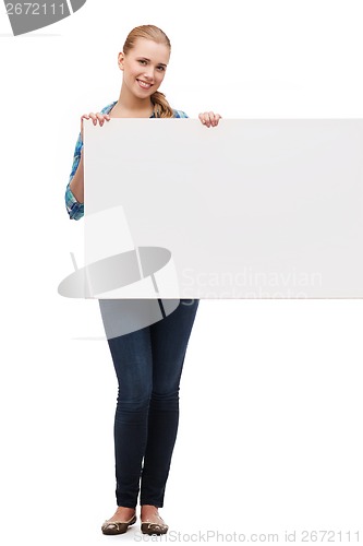 Image of smiling young woman with white blank board