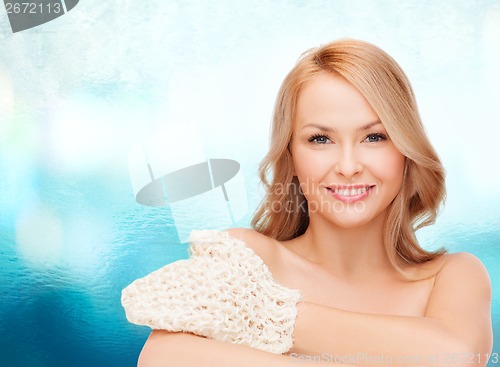 Image of smiling woman with exfoliation glove