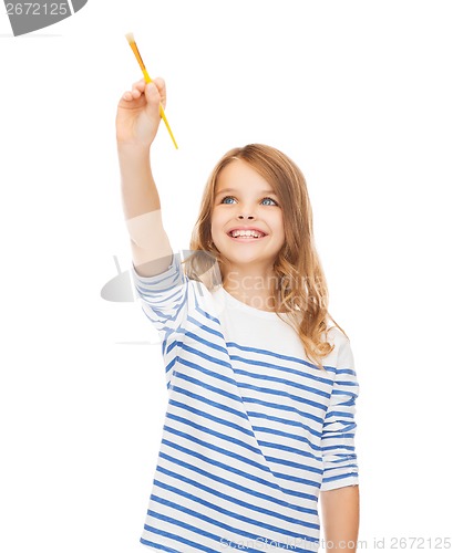 Image of cute little girl drawing with brush in the air