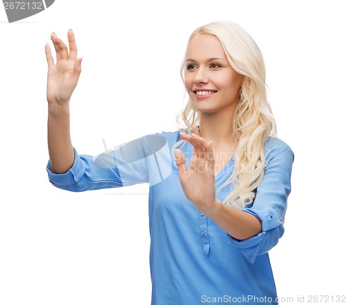 Image of smiling woman in working with virtual screen