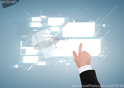 Image of close up of businessman pointing to virtual screen