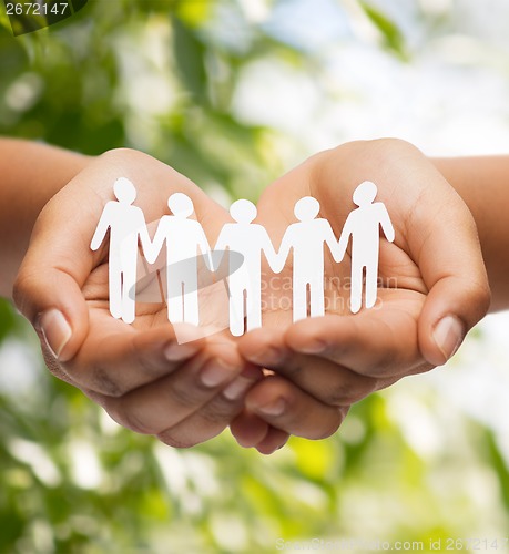 Image of womans hands with paper team