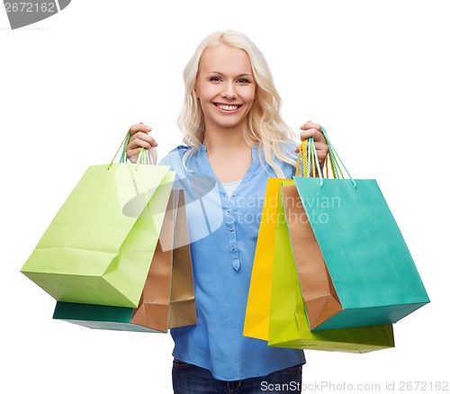 Image of smiling woman with many shopping bags