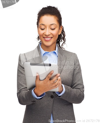 Image of smiling woman looking at tablet pc