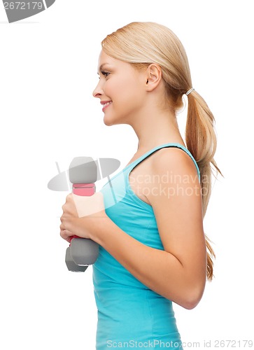 Image of young sporty woman with light dumbbells