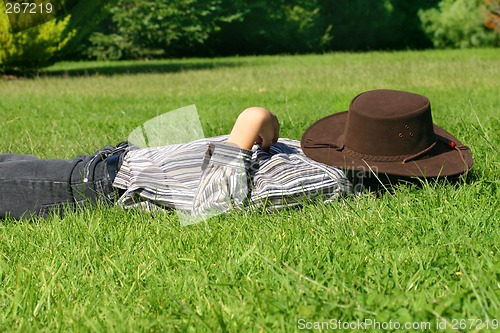 Image of Child asleep in the grass