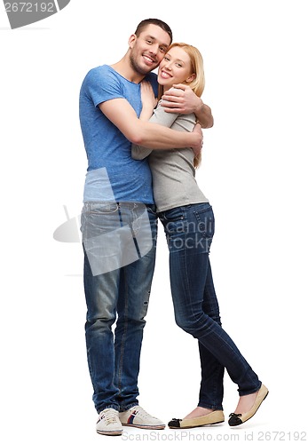 Image of smiling couple hugging