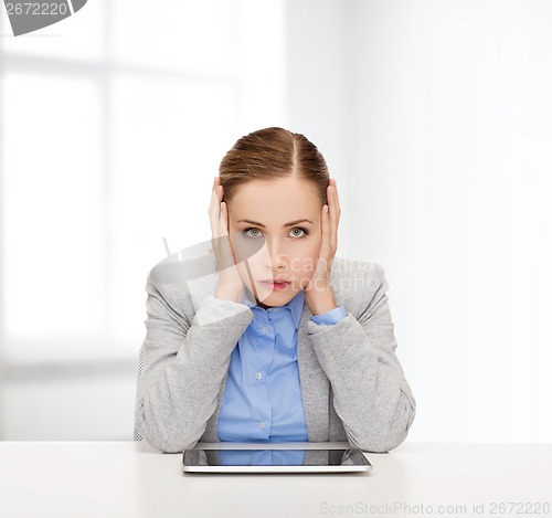 Image of smiling businesswoman with tablet pc