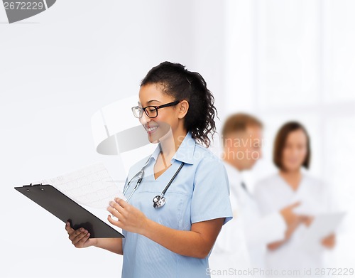 Image of smiling female african american doctor or nurse