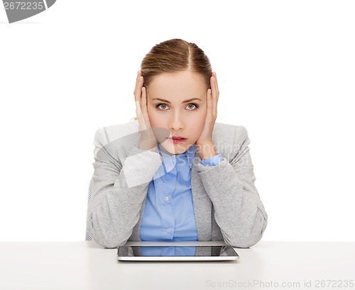 Image of smiling businesswoman with tablet pc