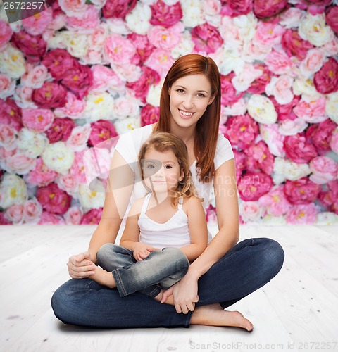 Image of happy mother with adorable little girl