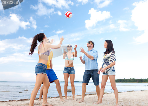 Image of group of friends having fun on the beach