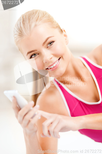 Image of smiling woman with smartphone