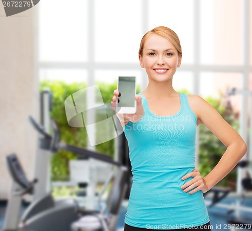 Image of sporty woman with smartphone