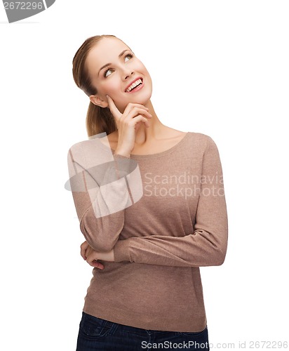 Image of smiling woman dreaming over white background