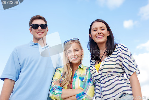 Image of group of friends having fun on the beach